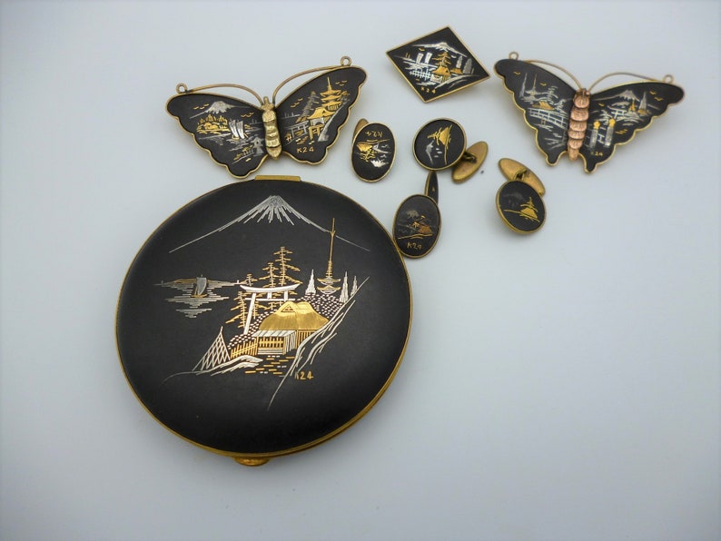 Vintage Amita Japan gold and silver inlay jewellery set comprising three brooches compact powder and two pair of cufflinks