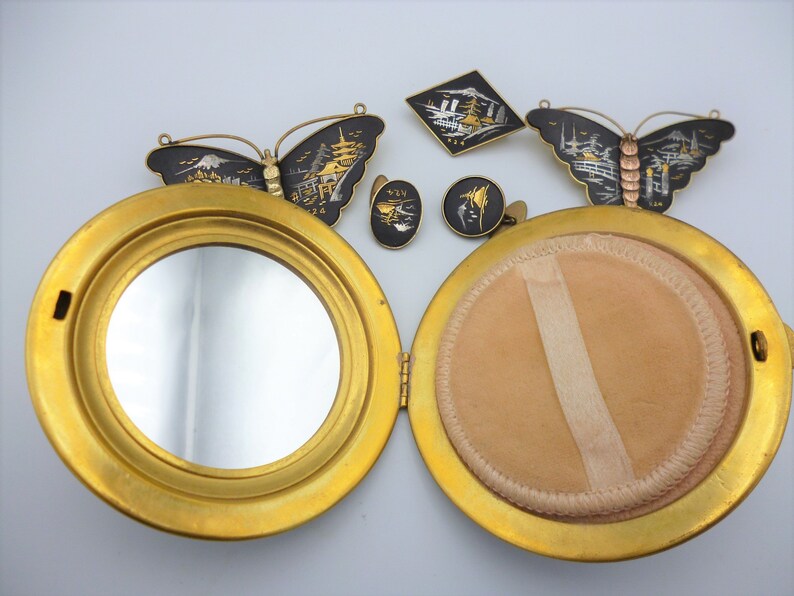 Vintage Amita Japan gold and silver inlay jewellery set comprising three brooches compact powder and two pair of cufflinks