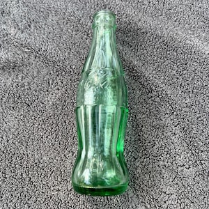 Unique Vintage Coca Cola Bottle: 1930s Embossed Glass from Peoria, Illinois