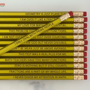 May include: A collection of yellow pencils with black text, each with a red eraser. The pencils have humorous math-related phrases like "Geometry is just plane fun" and "I only deal with prime people."