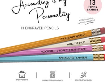 May include: A set of 13 engraved pencils in yellow, white, pink, and light blue with metallic ferrules and pink erasers. The pencils feature text including IT'S ACCRUAL WORLD, WHAT THE FICA?, ACCOUNTANTS WORK THEIR ASSETS OFF, and SPREADSHEET SAMURAI.