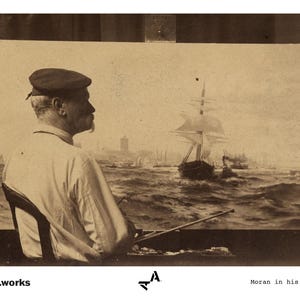 May include: A man in a cap sits in his studio, painting a seascape with a large ship in the foreground. The painting is on an easel and the man is holding a brush in his right hand.