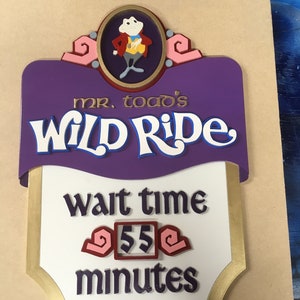 Mr Toad Wild Ride inspired wait time sign