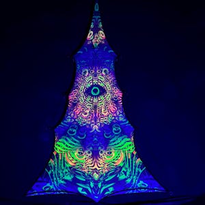 May include: A black triangular fabric tapestry with a psychedelic design featuring a large eye, green and pink swirls, and a repeating pattern of smaller eyes. The tapestry is illuminated with blacklight, making the colors glow brightly.