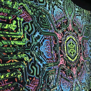 May include: A black tapestry with a vibrant, geometric design. The pattern features neon green, blue, pink, and orange lines resembling circuit board pathways. The central design is a hexagon with a green and yellow pattern.