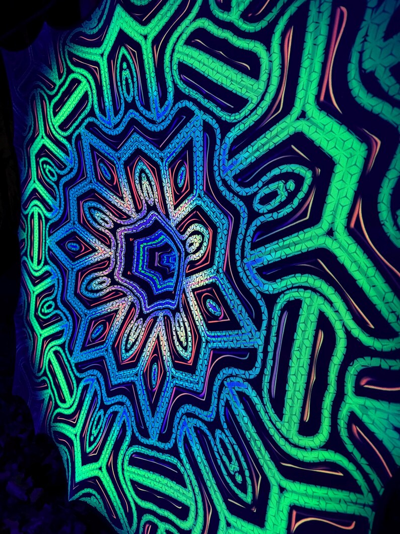 May include: A psychedelic mandala pattern in shades of green, blue, and pink. The pattern is made up of intricate lines and shapes that create a hypnotic effect.