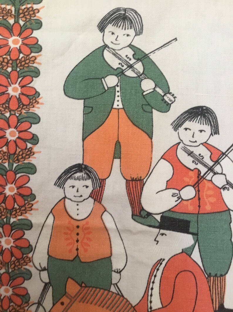 May include: A vintage fabric with a repeating pattern of people playing music. The people are drawn in a simple style with orange, green, and black clothing. The background is white with a border of orange flowers.