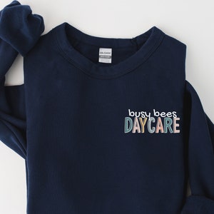 Custom Daycare Sweatshirt | Personalized In Home Day Care Logo Shirt | Childcare Name Gift Tee | Babysitter Nanny Christmas Gifts Crewneck