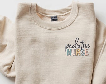 Pediatric Nurse Sweatshirt | Pediatrics RN PEDS Pocket Nursing Shirt | Cute PICU Children's Nurses Appreciation Nurse's Week Gift Sweater