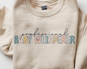 Newborn Photographer Sweatshirt | Professional Baby Whisperer Photography shirt | Baby Swaddler Studio Sweater Gift | Gifts for Photographer