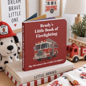 May include: A red board book titled Brady's Little Book of Firefighting with a white graphic of a fire engine on the cover. The book features the subtitle Big Adventures for a Little Firefighter and is resting on a beige book titled Little Heroes.