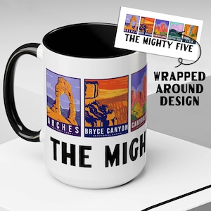 May include: White ceramic mug with a black interior and handle. The mug features a design with the text "THE MIGHTY FIVE" and illustrations of Arches, Bryce Canyon, Canyonlands, Capitol Reef, and Zion National Parks. A small card with the same design is attached.