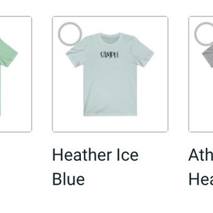 Puede incluir: Una colecci&oacute;n de camisetas de manga corta en varios colores, incluyendo negro jaspeado, menta y azul. Cada camiseta presenta la palabra "COMPU" impresa en un color contrastante en el pecho. Las camisetas se muestran sobre un fondo blanco.