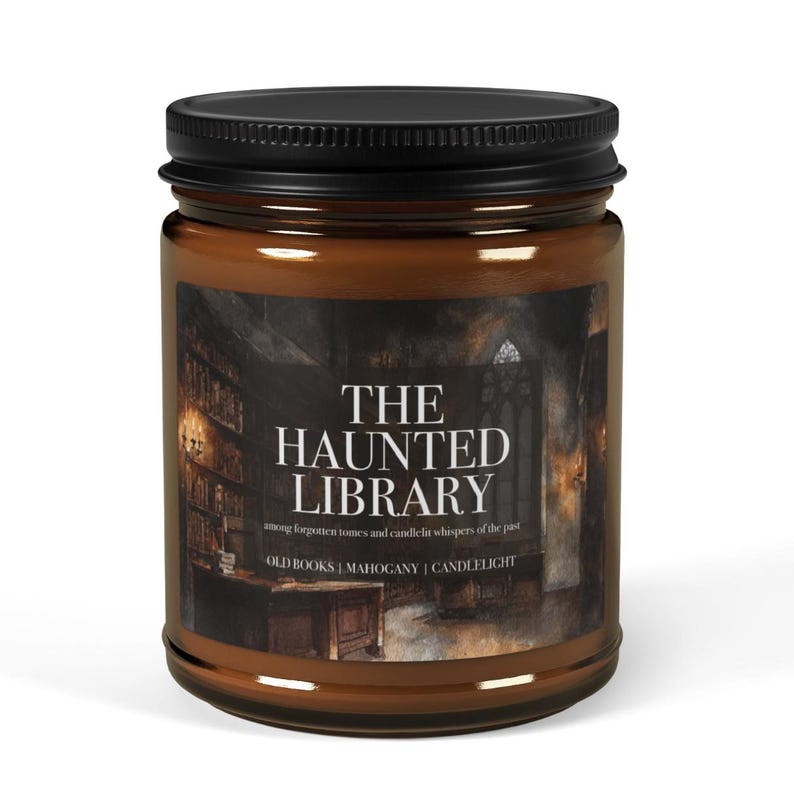May include: A brown glass jar candle with a black lid. The label reads "THE HAUNTED LIBRARY" with text below it. The candle's theme is old books, mahogany, and candlelight.