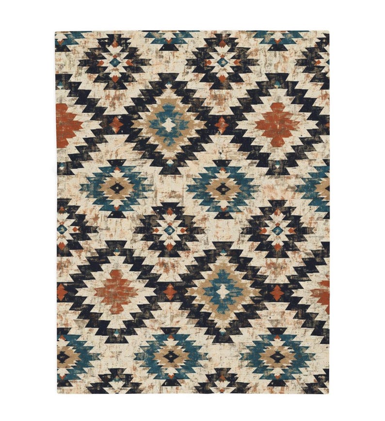 May include: A rectangular rug with a repeating geometric pattern in shades of navy, teal, rust, and beige. The design features diamond and zigzag shapes, creating a textured, distressed look. The rug's style is reminiscent of Southwestern or tribal designs.