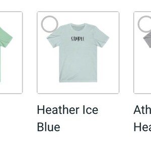 May include: A collection of short-sleeved t-shirts in various colors, including black heather, mint, and blue. Each shirt features the word "COMPU" printed in a contrasting color across the chest. The shirts are displayed on a white background.