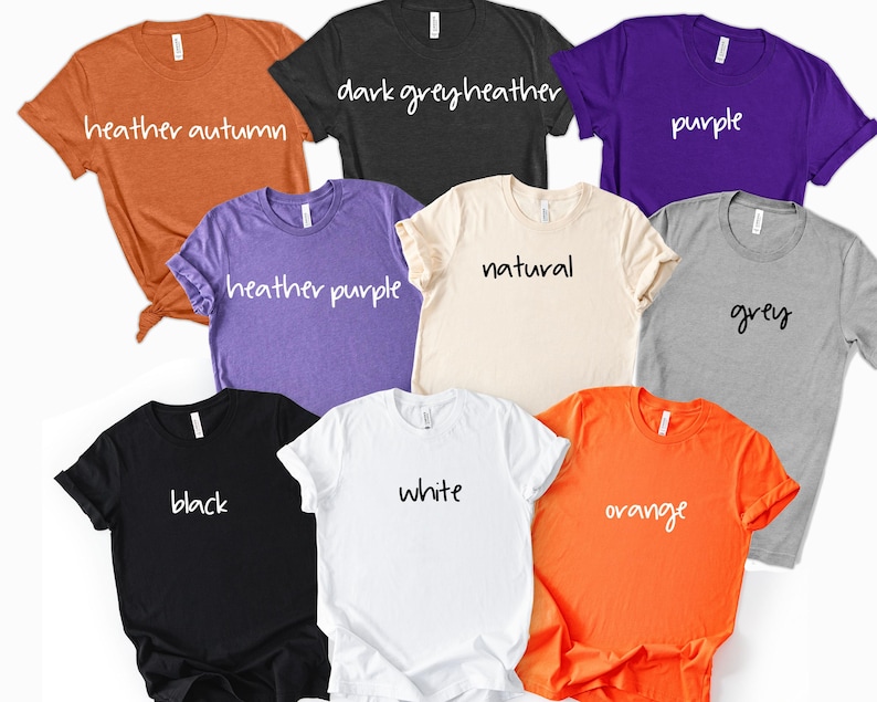 May include: A collection of eight short-sleeve crew neck t-shirts in various colors including heather autumn, dark grey heather, purple, heather purple, natural, grey, black, white, and orange, each labeled with its respective color name in white text.
