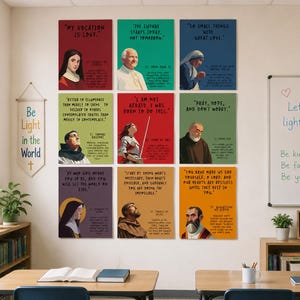May include: Nine colourful inspirational posters with quotes and portraits of religious figures. The posters are displayed on a classroom wall. The text includes phrases like "My Vocation is Love" and "Let your light shine!"