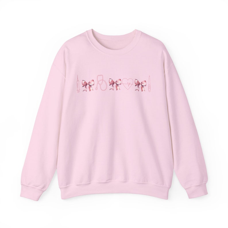Coquette Nurse Sweatshirt | Cute RN Shirt, Pediatric, NICU, Icu, ER Graduation Gift Sweater, Nurse Practitioner, Labor Delivery, Mother Baby Light Pink