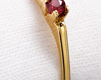 Gold ring with natural ruby, luxury detail for special occasions
