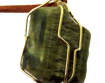Rough green tourmaline pendant in sterling silver and leather.