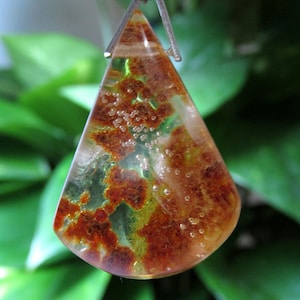 Raw amber pendant with inlaid water drops, 925 silver