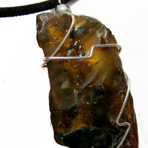 Raw green amber pendant from the Dominican Republic in 925 silver