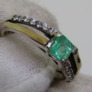 Silver and yellow gold plate ring with natural emerald and zircons