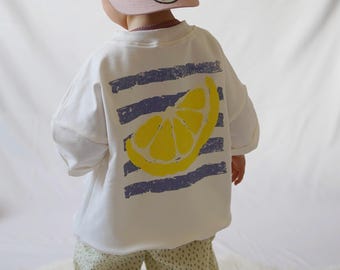 Camiseta infantil extragrande con estampado de limones | color crema | Camiseta de verano para bebés y niños | Tallas de la 62 a la 128 | Camiseta con estampado en la espalda