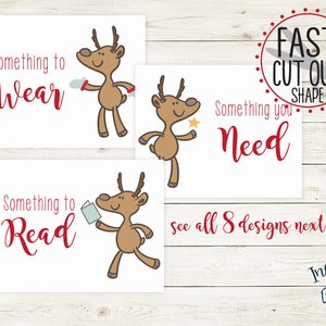 Puede incluir: Tres tarjetas imprimibles con una ilustración de reno y el texto "Something to Wear", "Something to Read" y "Something you Need".