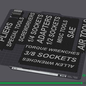 May include: Black tool organizer with white text labels for various tools, including pliers, screwdrivers, sockets, and air tools. The labels are arranged in rows and columns, with a grid pattern in the background.