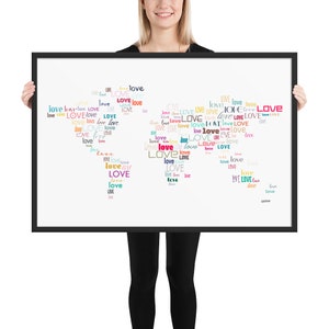 May include: A framed print with a heart-shaped word cloud of the word "love" in various colors and fonts. The word "love" is repeated many times in different sizes and colors.