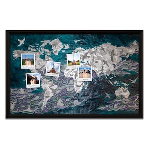May include: A world map with a teal background and silver and purple clouds. There are five polaroid photos pinned to the map, each with a different city name written below: San Francisco, New York City, Paris, Venice, and Santa Fe.