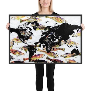 May include: A black and white world map print with a colorful fish pattern. The map is surrounded by a black frame.