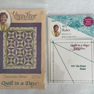 May include: Two quilting supplies: a pattern packet and a ruler. The pattern packet features a quilt design with purple and green geometric shapes. The ruler is clear acrylic and labeled "4 1/2" On-Point Ruler". Both items are from "Quilt in a Day".