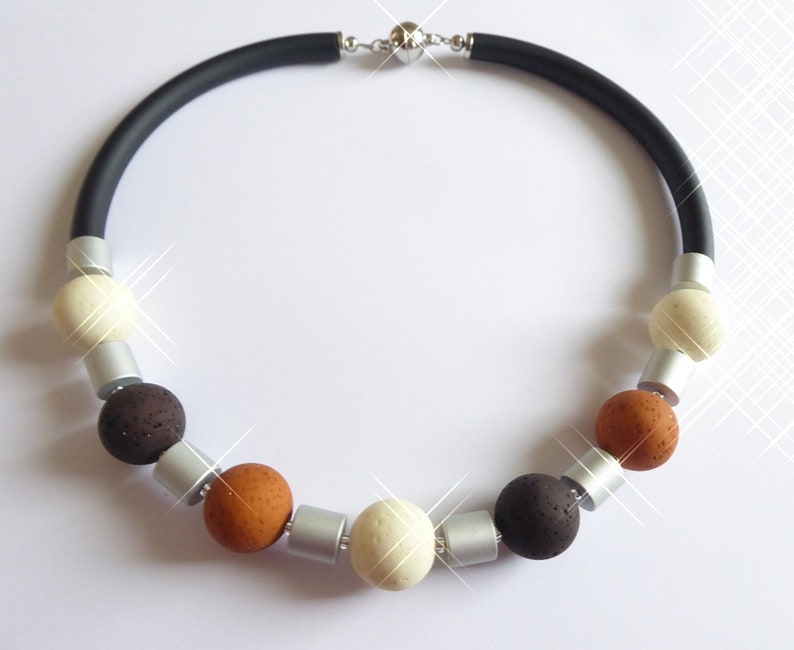 statement striking Collier made of extra large Polaris beads brown alu anodized also in other colors with rubber lush