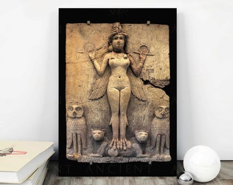 May include: A framed relief sculpture depicting a nude female figure with wings, holding objects in each hand. Two owls flank the figure, with two lion-like creatures below. The artwork is in shades of tan and brown.