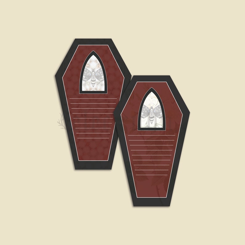 May include: Two red coffin-shaped note cards with black borders and a white moth design in the center of each card.