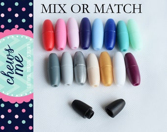May include: Assortment of 18 colorful plastic slider clasps in various colors, including red, pink, blue, green, gray, silver, gold, white, and purple. The clasps are oval-shaped and have a smooth, matte finish.  The text "MIX OR MATCH" is printed at the top of the image.