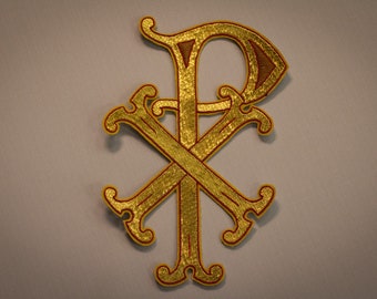 May include: A gold embroidered symbol of the Chi Rho, a Christian symbol representing the first two letters of Christ's name in Greek.