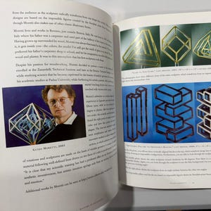 May include: A page from a book showcasing geometric sculptures and a portrait of Guido Moretti. The sculptures include transparent geometric shapes and stacked block designs. The portrait shows a man with glasses, and the text includes the year 2003.