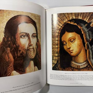 May include: A book spread displaying religious artwork. The left page shows a portrait with figures in the background. The right page depicts a woman with birds. Both images have a warm colour palette and are oil paintings.