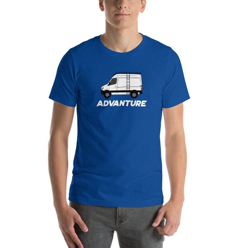 May include: A royal blue t-shirt featuring a white silhouette of a van with a ladder on top. The text "ADVANTURE" is printed in white below the van.