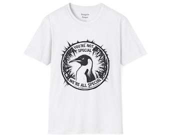 Puede incluir: Camiseta blanca con un gráfico en blanco y negro de un pingüino dentro de un círculo con el texto "YOU'RE NOT SPECIAL WE'RE ALL SPECIAL". El texto "Penguin Power" está encima del gráfico.