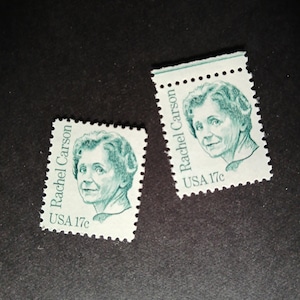 May include: Two green and white postage stamps featuring a portrait of Rachel Carson. The stamps are marked "Rachel Carson" and "USA 17c". The stamps are rectangular with perforated edges.