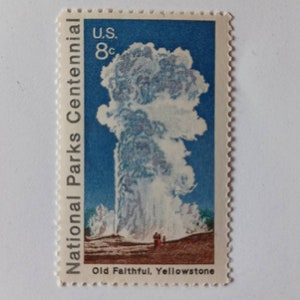 May include: A vintage US postage stamp featuring a blue sky with a large white geyser erupting. The stamp reads "National Parks Centennial" and "U.S. 8c" with the text "Old Faithful, Yellowstone" at the bottom.