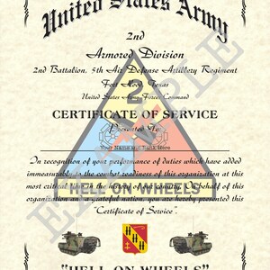 May include: A certificate of service for the United States Army 2nd Armored Division, 2nd Battalion, 5th Air Defense Artillery Regiment, Fort Hood, Texas. The certificate features a red, white, and blue triangle with the words "Certificate of Service" and "Presented To" in black text. The certificate also features a black and white illustration of two military vehicles with the words "HELL ON WHEELS" in black text.