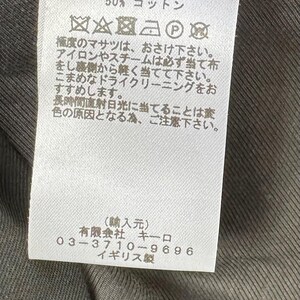 Puede incluir: Una etiqueta de ropa blanca con texto japon&eacute;s y s&iacute;mbolos de cuidado. Indica la composici&oacute;n de la tela: 60% lana, 40% nailon, y forro de 50% cupro y 50% algod&oacute;n. Incluye instrucciones de lavado y datos del fabricante.