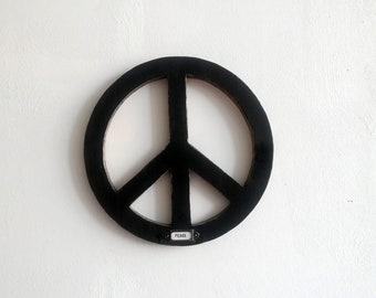 Peace sign made of wood with sign wall decoration