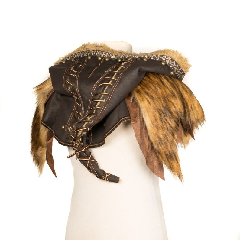Barbarian Master 3-Piece Set – Perfect for Fighter, Warlock, and Assassin characters in LARP, Cosplay, and Ren Faire events. Includes: Faux Fur & Leather Waistcoat, Ornate Hood, and Faux Fur Vambraces with foam Throwing Dagger.
